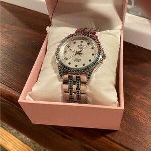 Juicy couture ladies watch. Silver with red and green stones.
